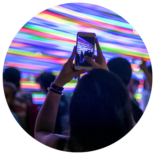 Person photographing lights at night